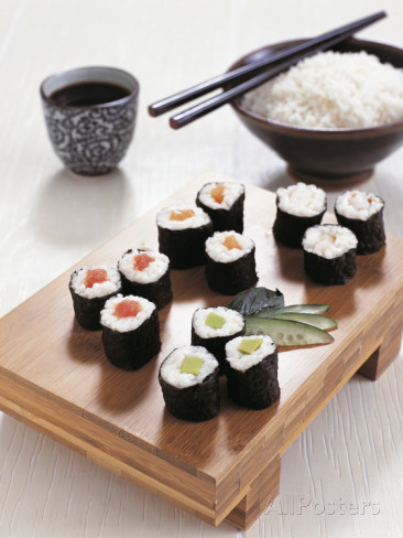 close-up-of-sushi-rolls-with-a-bowl-of-rice-and-chopsticks